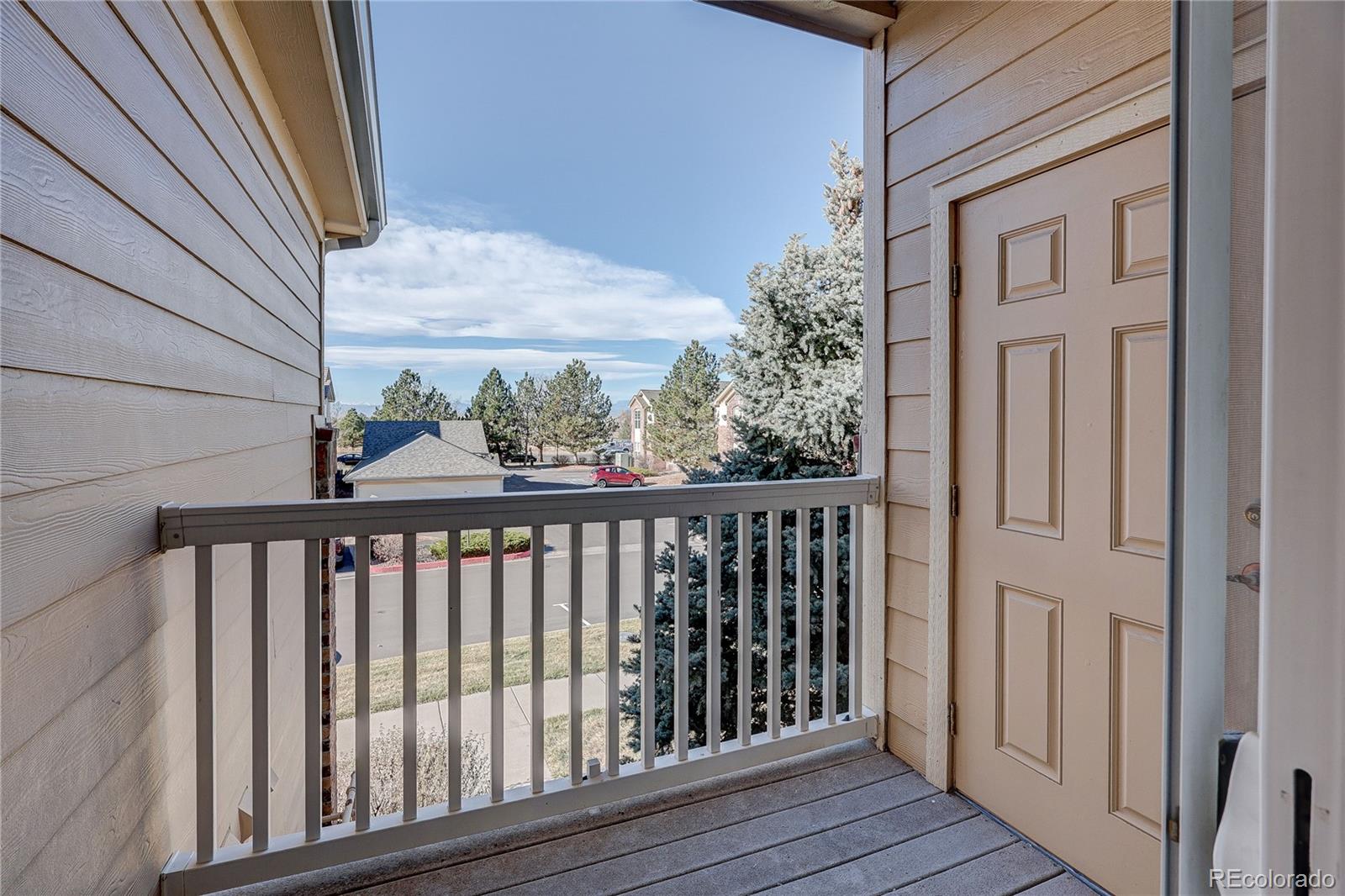 5756 North Genoa Way, Unit 12208 Aurora, CO 80019 - Photo 25 of 33 a view of a balcony with wooden floor