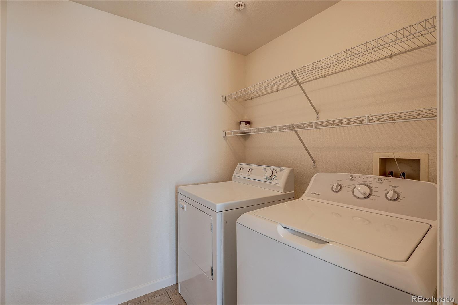 5756 North Genoa Way, Unit 12208 Aurora, CO 80019 - Photo 30 of 33 a utility room with dryer and washer