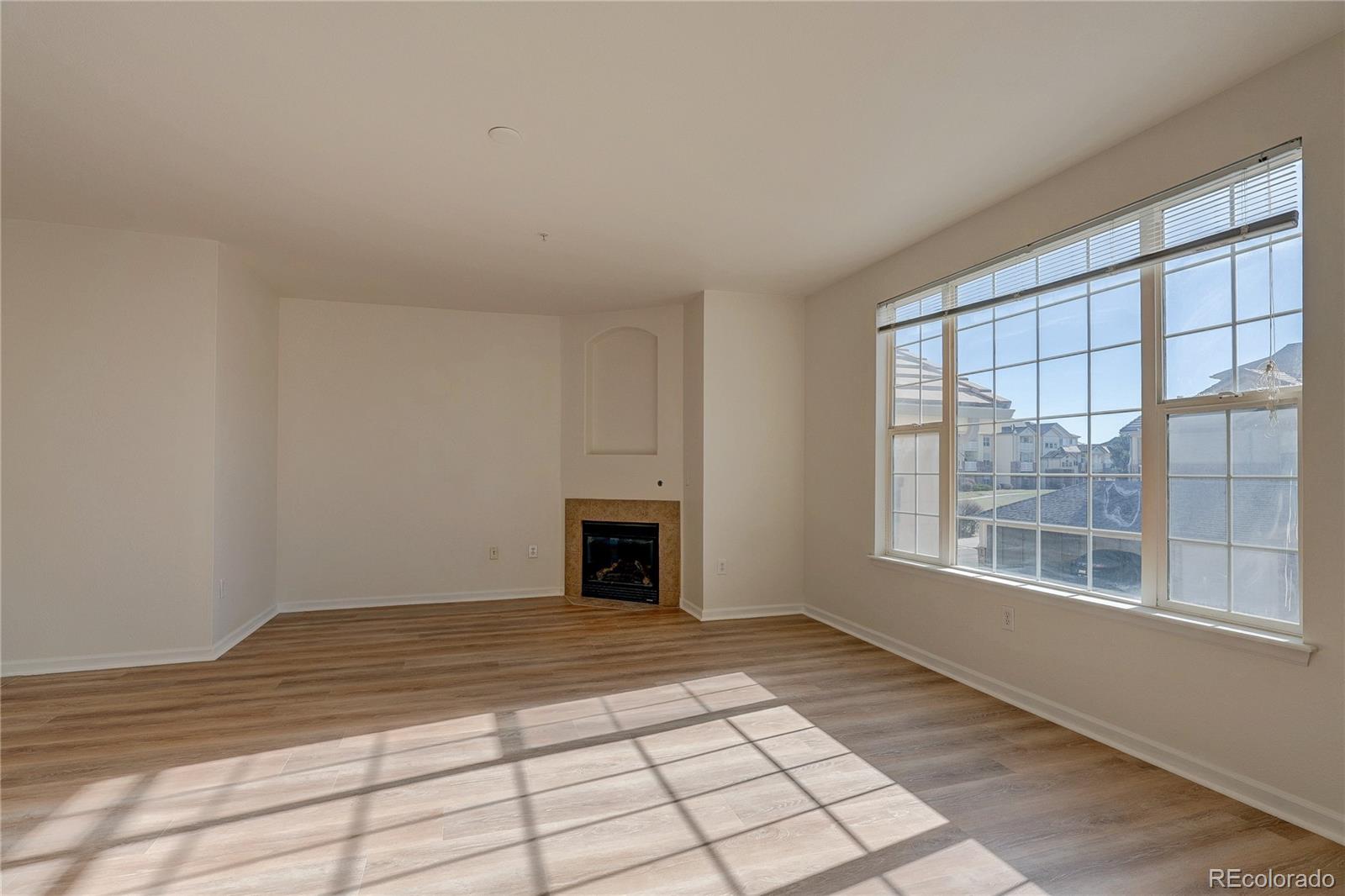 5756 North Genoa Way, Unit 12208 Aurora, CO 80019 - Photo 7 of 33 a view of empty room with windows