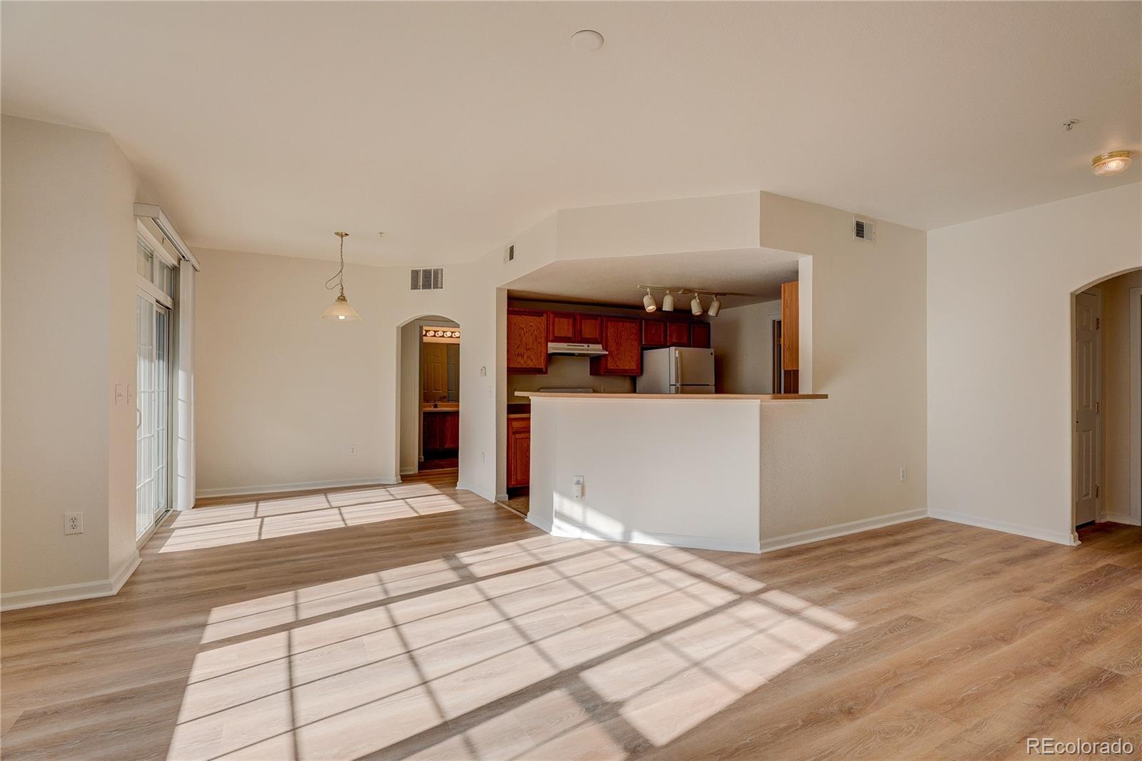 5756 North Genoa Way, Unit 12208 Aurora, CO 80019 - Photo 8 of 33 a view of a room with a wooden floor