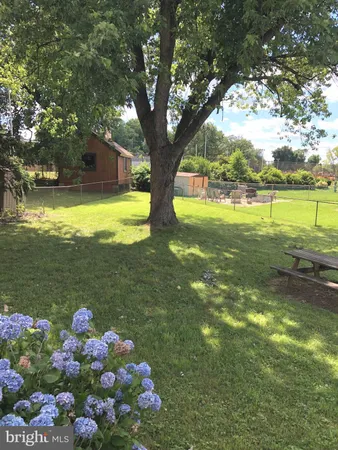 a view of a house with a big yard