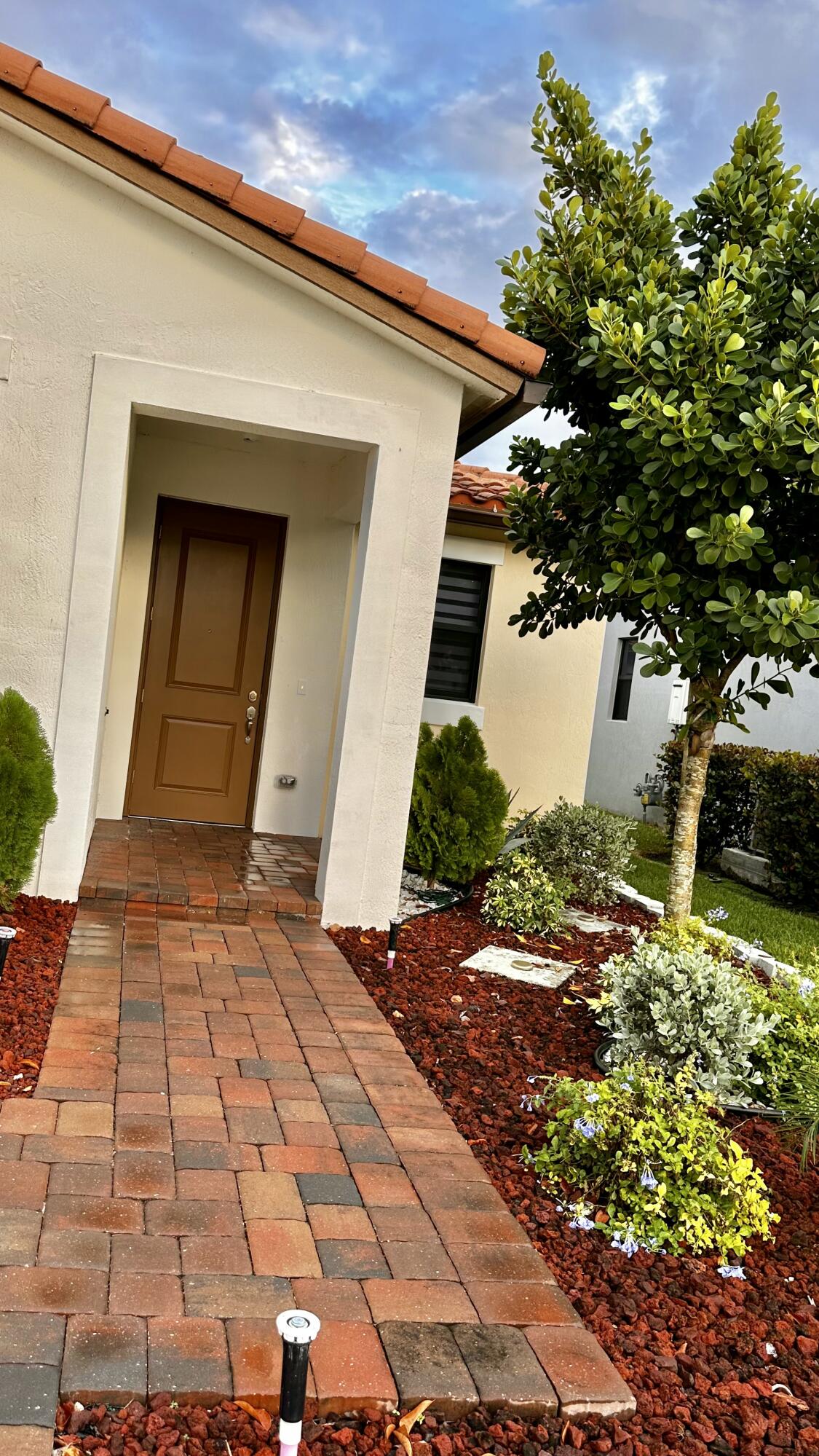 a front view of a house with a yard