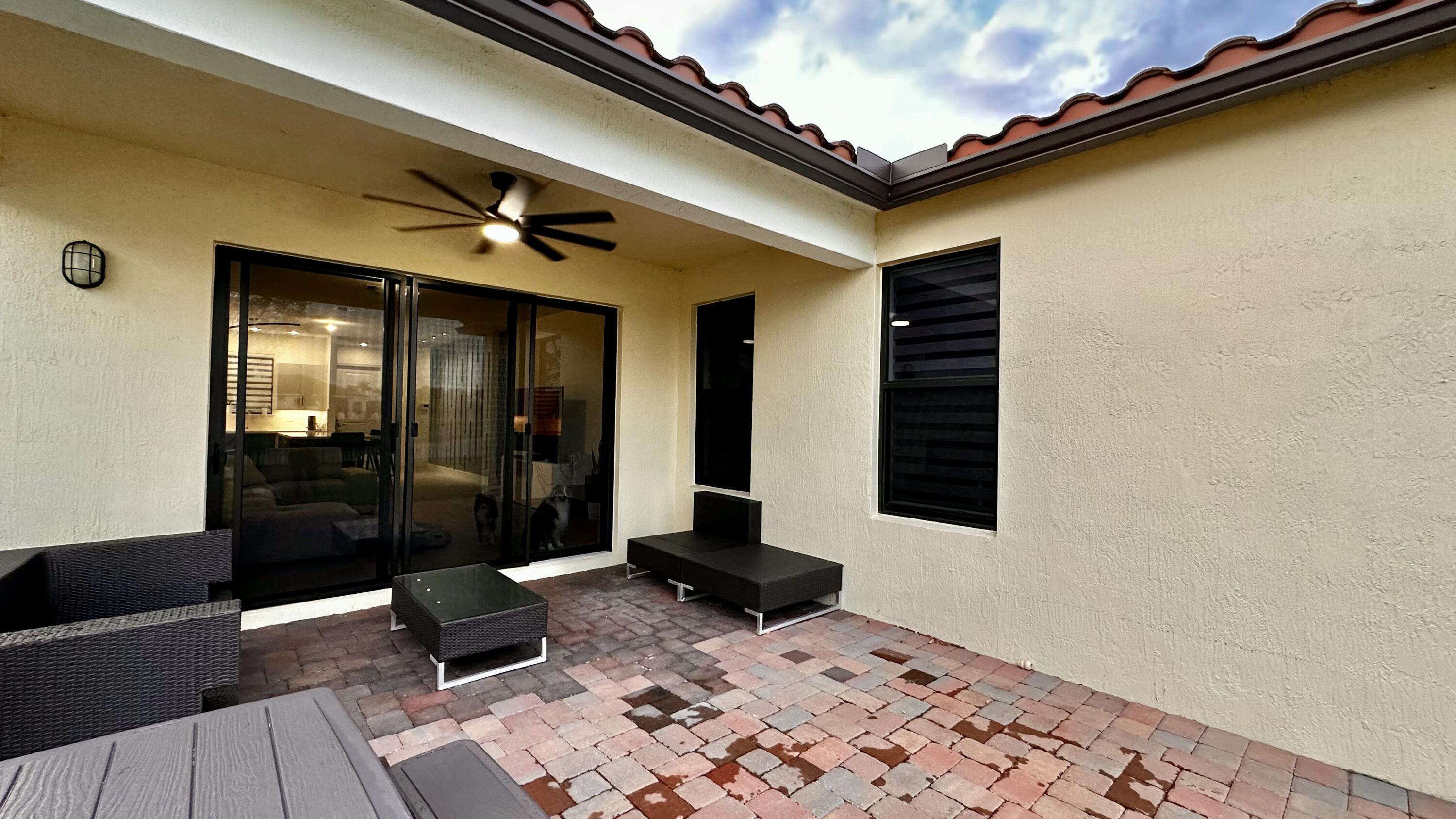 5570 Quiet Lake Place Westlake, FL 33470 - Photo 3 of 18 a black and white building with glass windows