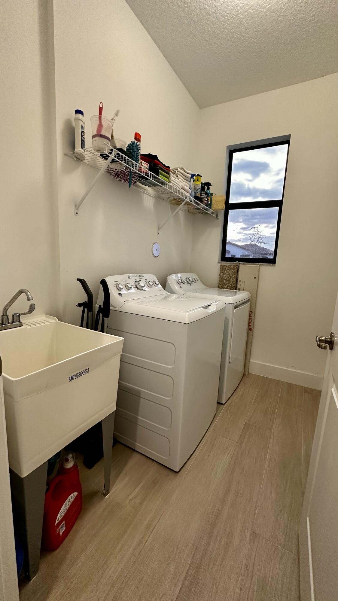 5570 Quiet Lake Place Westlake, FL 33470 - Photo 9 of 18 a utility room with dryer washer and sink