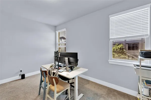 a view of a workspace with furniture