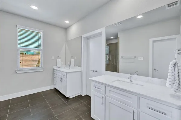 a bathroom with a sink a vanity and a mirror