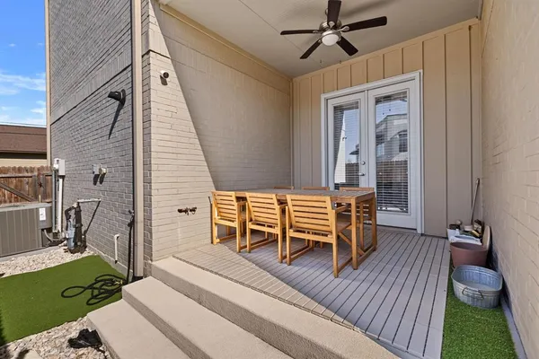 a balcony with furniture and a garden