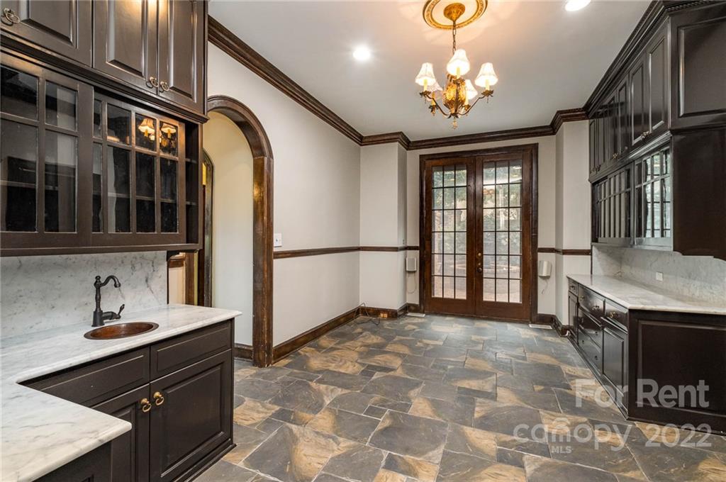 1107 Queens Road Charlotte, NC 28207 - Photo 11 of 44 a spacious bathroom with a double vanity sink and a mirror