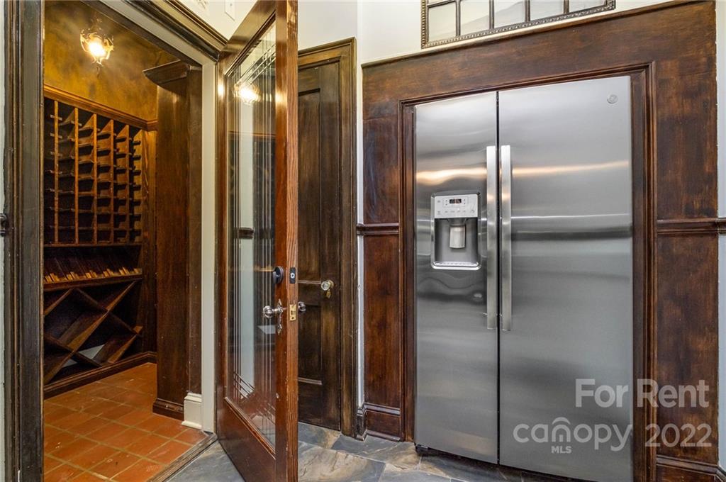 1107 Queens Road Charlotte, NC 28207 - Photo 15 of 44 a bathroom with a glass shower door
