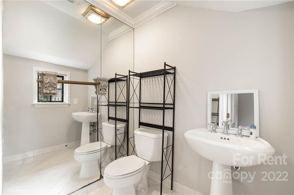 1107 Queens Road Charlotte, NC 28207 - Photo 35 of 44 a bathroom with a sink toilet and shower
