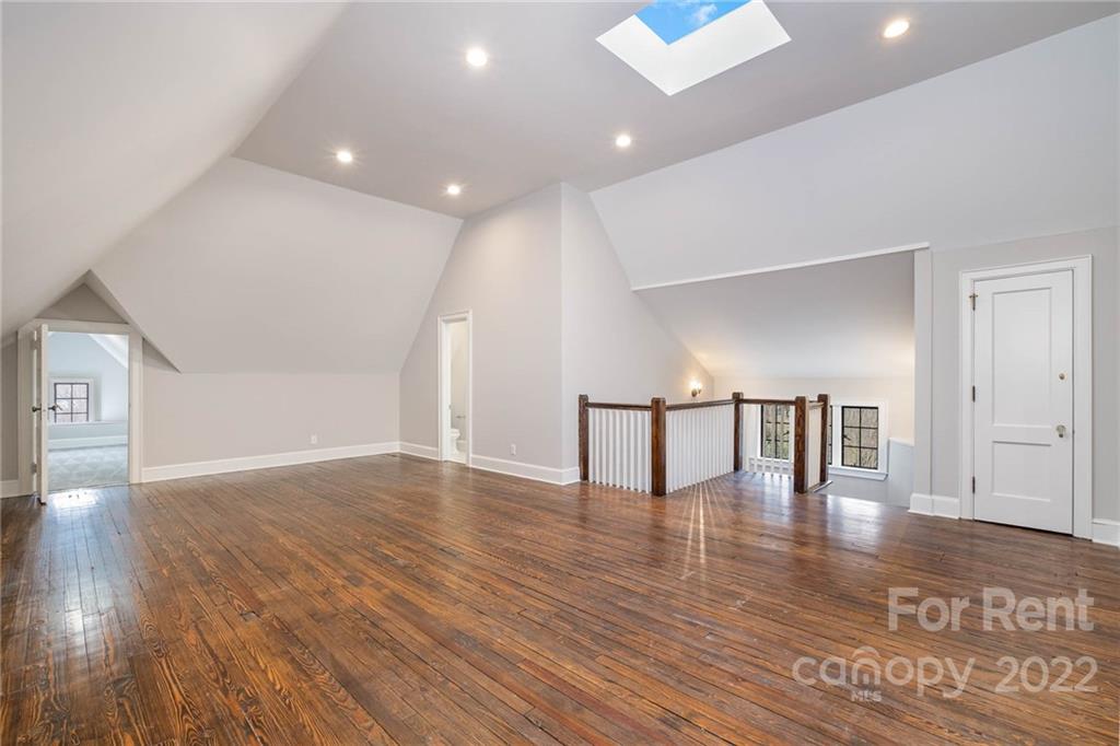 1107 Queens Road Charlotte, NC 28207 - Photo 37 of 44 a view of empty room with wooden floor