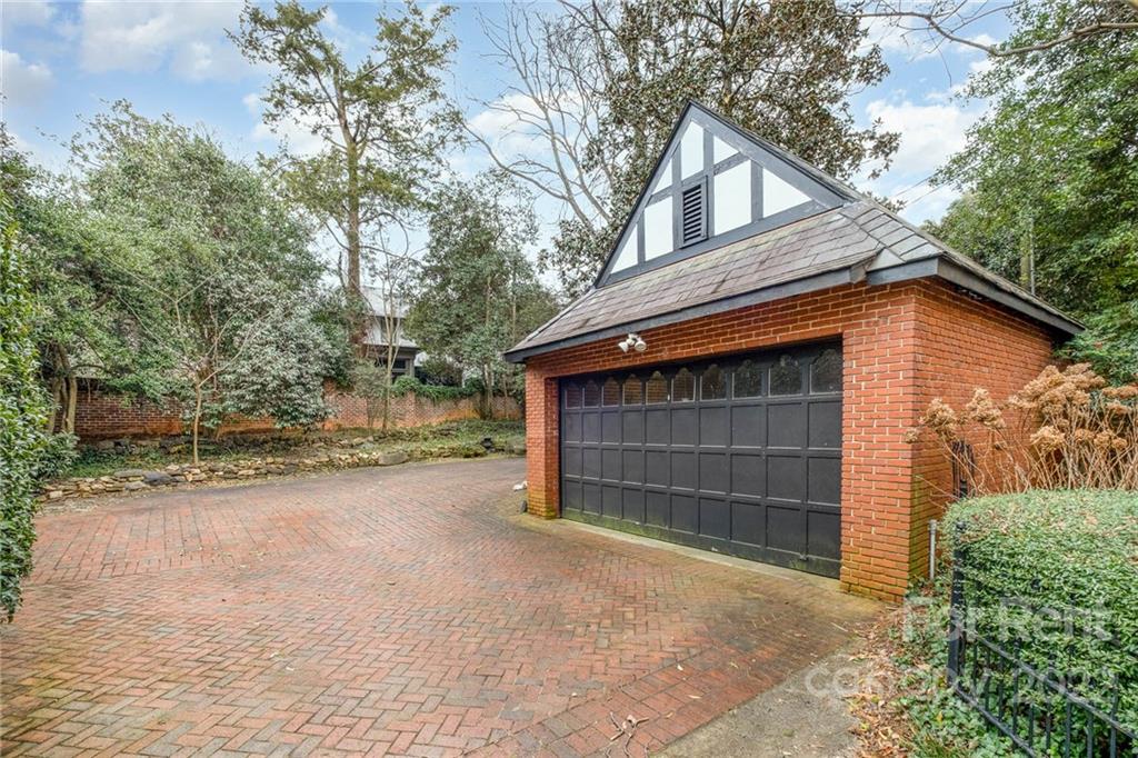 1107 Queens Road Charlotte, NC 28207 - Photo 42 of 44 a house with trees in the background