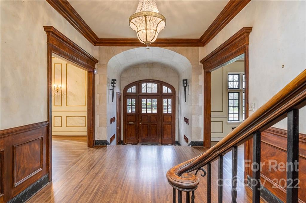 1107 Queens Road Charlotte, NC 28207 - Photo 6 of 44 a view of an entryway with wooden floor