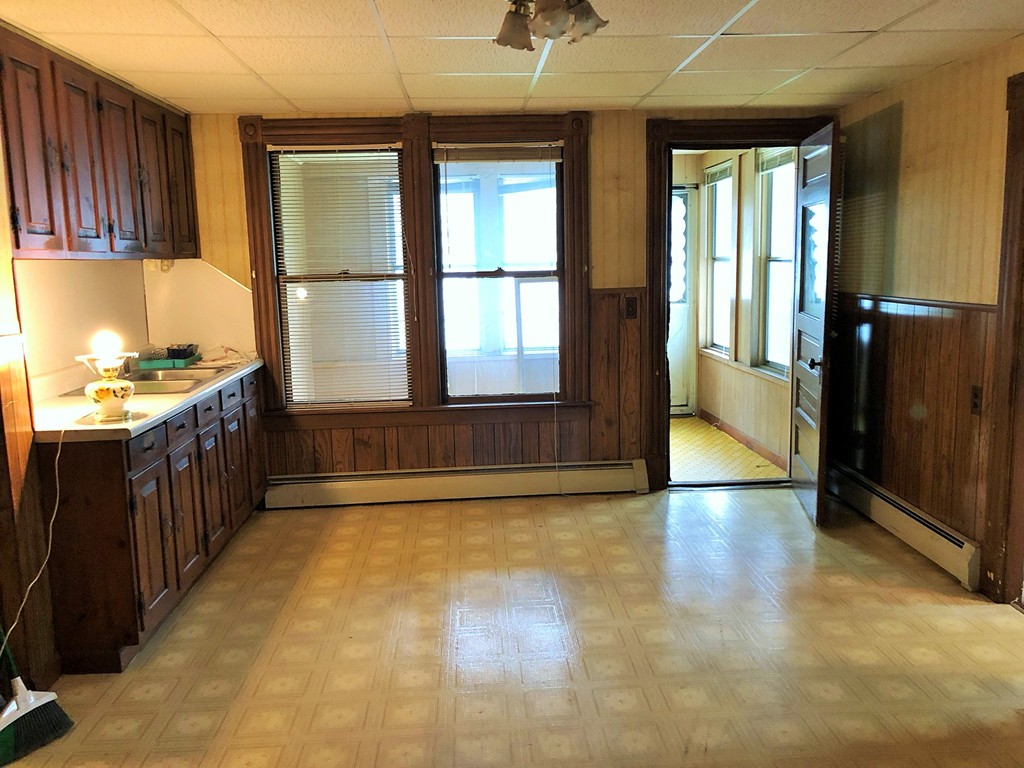2022-2024 Palmer Road Three Rivers, MA 01080 - Photo 18 of 30 a view of a kitchen with a sink and a window