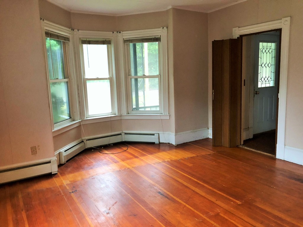 2022-2024 Palmer Road Three Rivers, MA 01080 - Photo 21 of 30 an empty room with wooden floor and windows