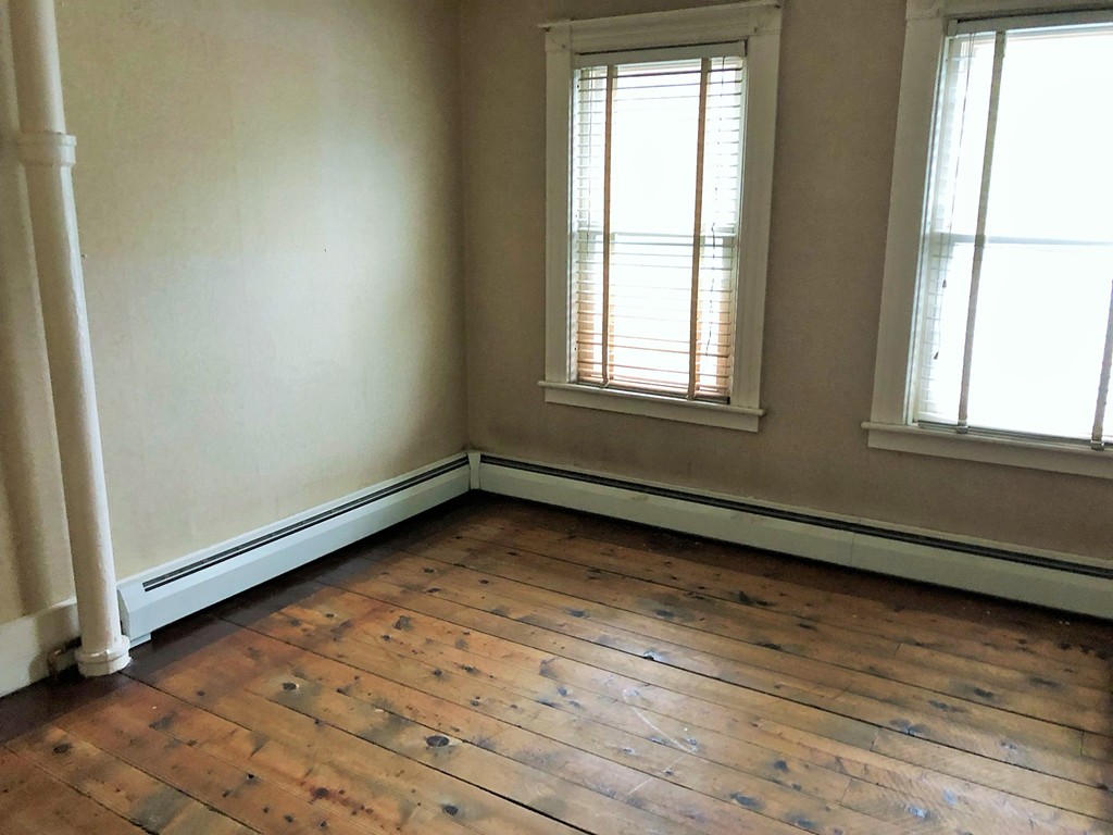 2022-2024 Palmer Road Three Rivers, MA 01080 - Photo 26 of 30 an empty room with wooden floor and windows