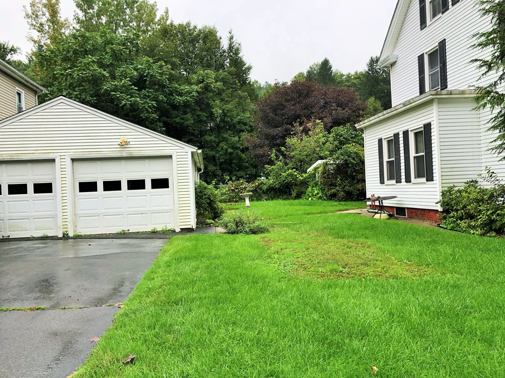 2022-2024 Palmer Road Three Rivers, MA 01080 - Photo 3 of 30 a front view of a house with a yard