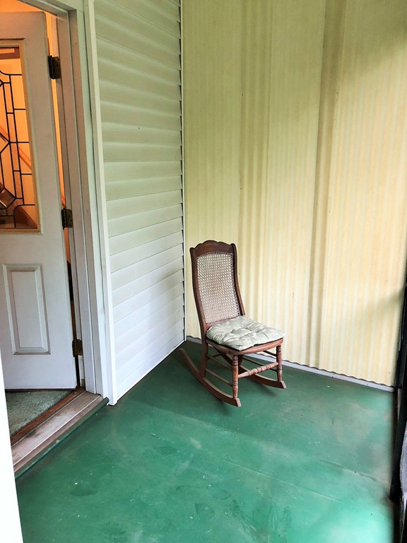 2022-2024 Palmer Road Three Rivers, MA 01080 - Photo 4 of 30 a view of a backyard with a chair and a window