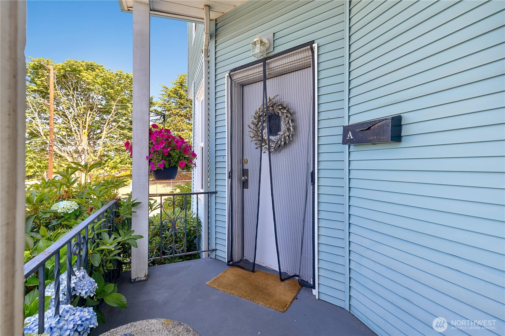 2601 Rucker Avenue Everett, WA 98201 - Photo 18 of 39 a view of a house with a potted plant and a window