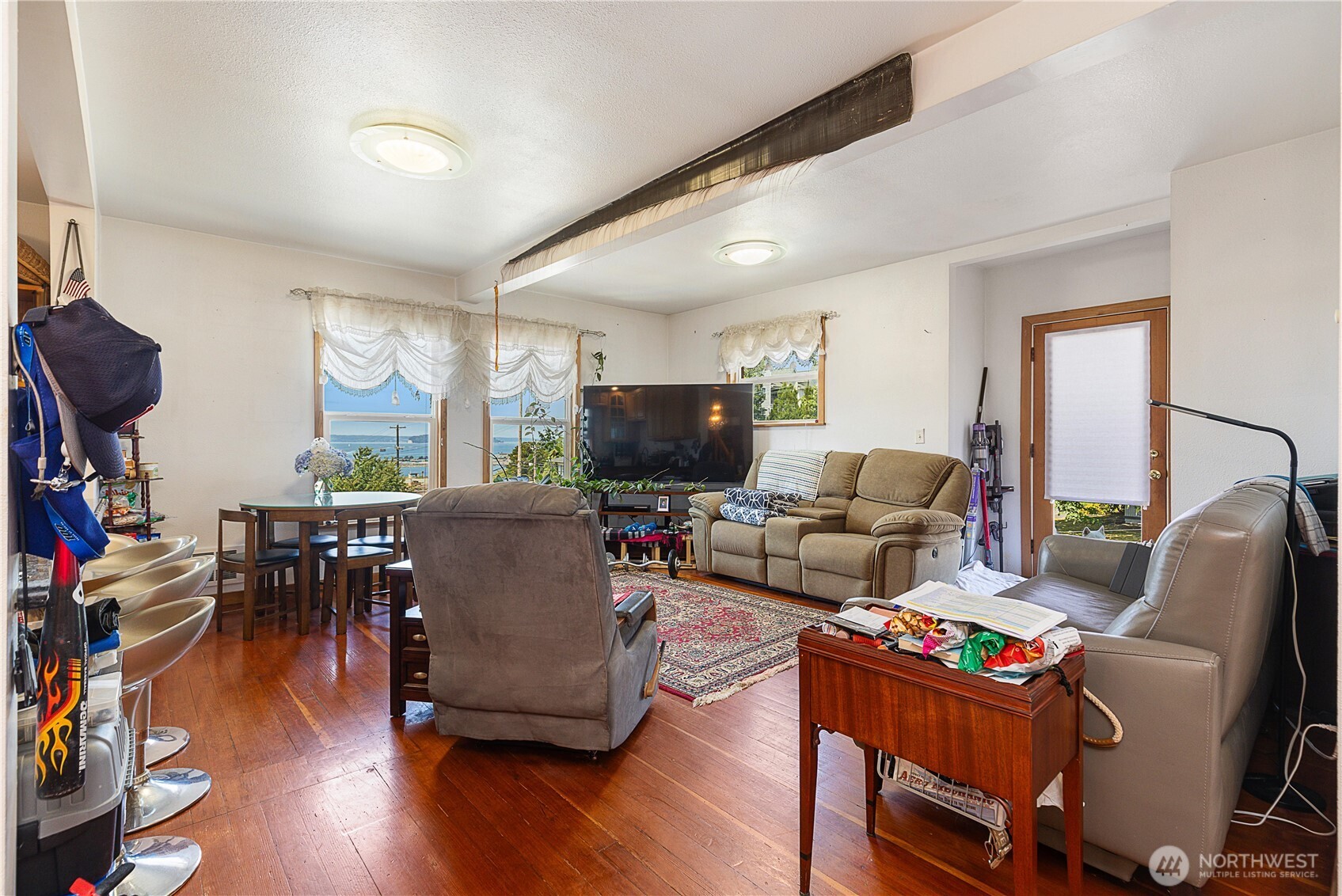 2601 Rucker Avenue Everett, WA 98201 - Photo 29 of 39 a living room with furniture and a flat screen tv