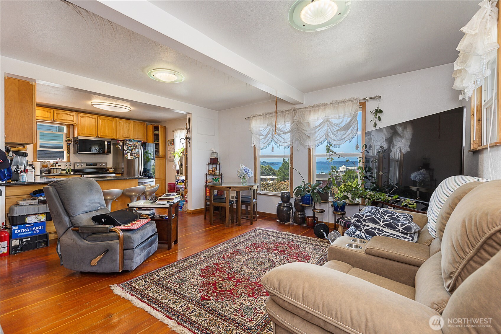 2601 Rucker Avenue Everett, WA 98201 - Photo 30 of 39 a living room with furniture fireplace and a flat screen tv