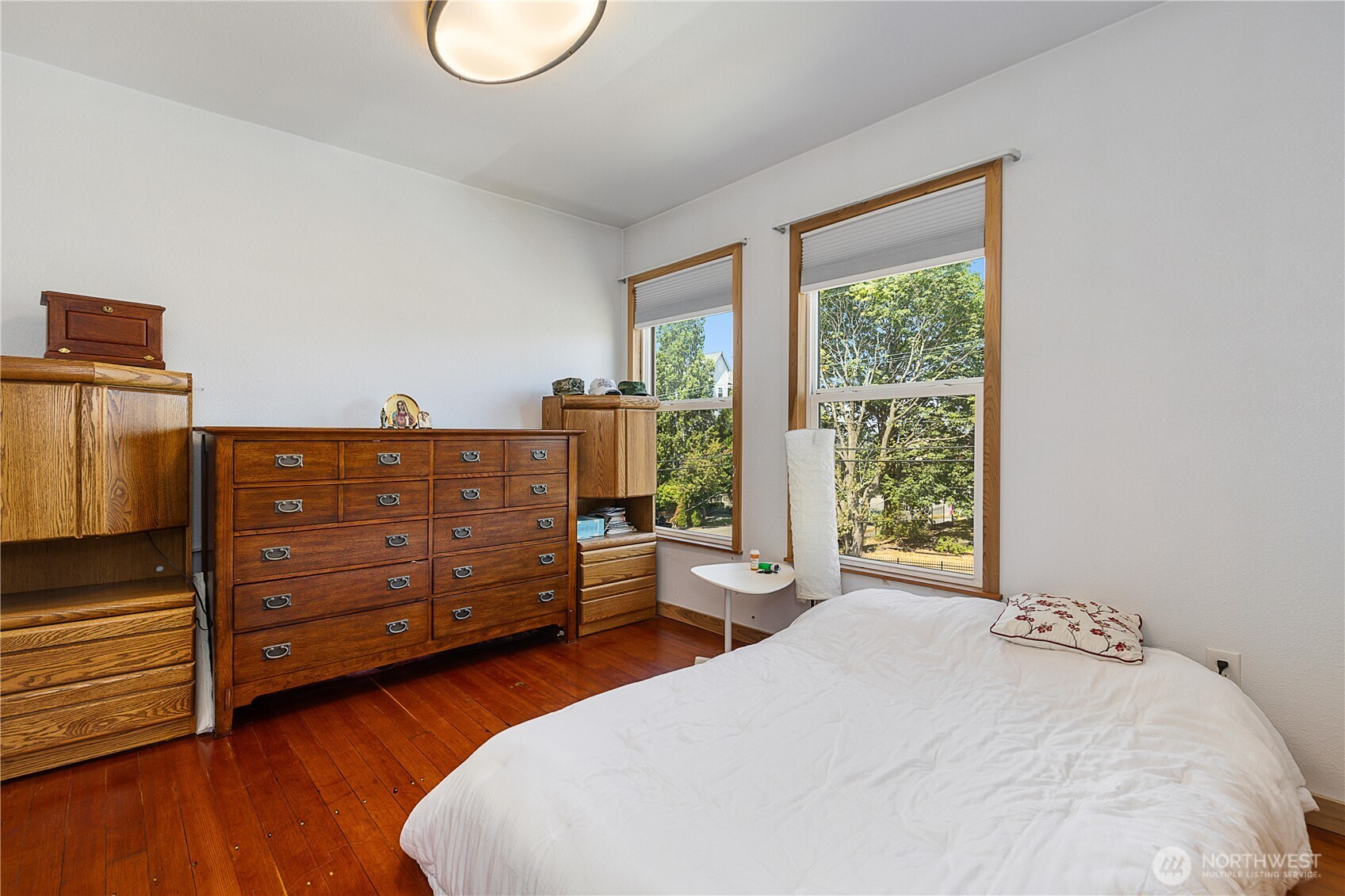 2601 Rucker Avenue Everett, WA 98201 - Photo 33 of 39 a bedroom with a bed and wooden floor