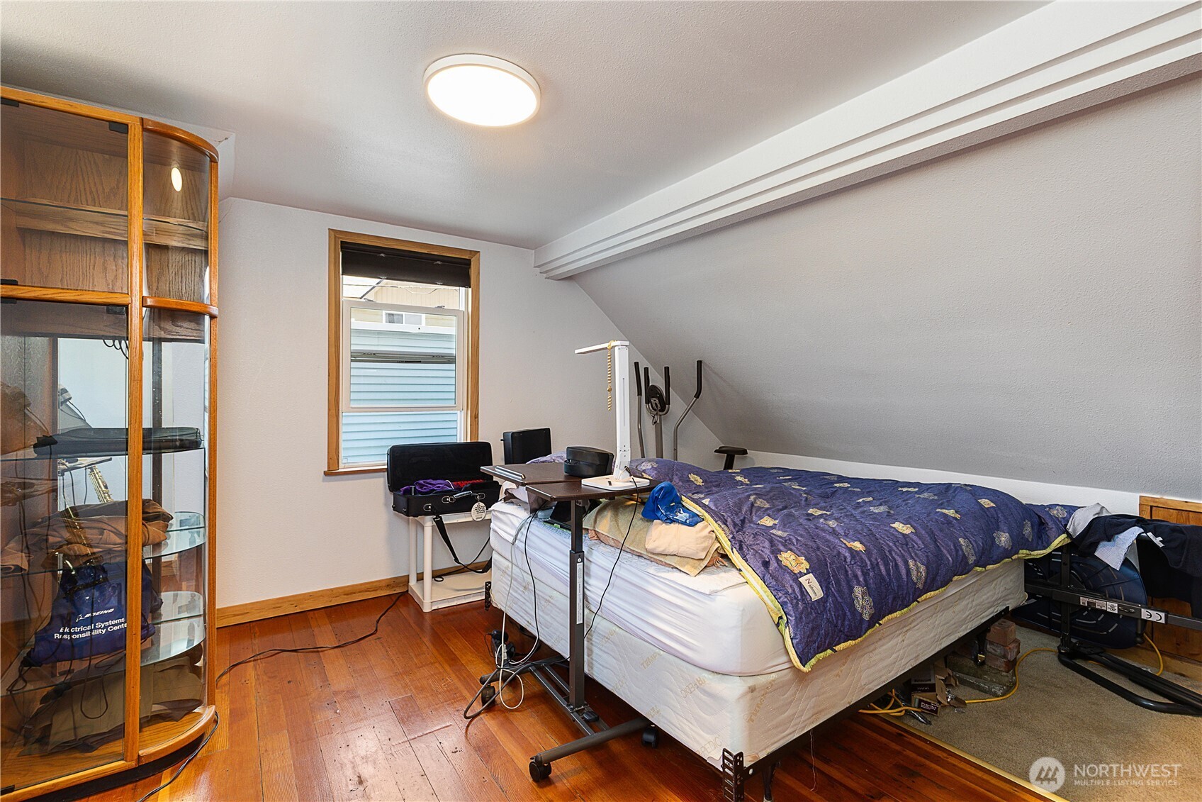 2601 Rucker Avenue Everett, WA 98201 - Photo 34 of 39 a bed sitting in a room next to a window