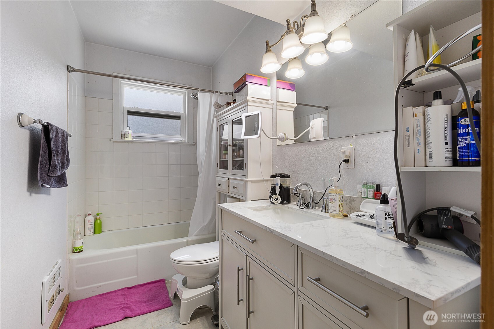 2601 Rucker Avenue Everett, WA 98201 - Photo 35 of 39 a bathroom with a sink a vanity and a mirror