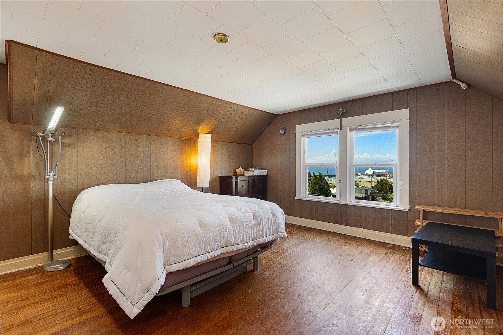 2601 Rucker Avenue Everett, WA 98201 - Photo 37 of 39 a large bed sitting in a bedroom next to a window