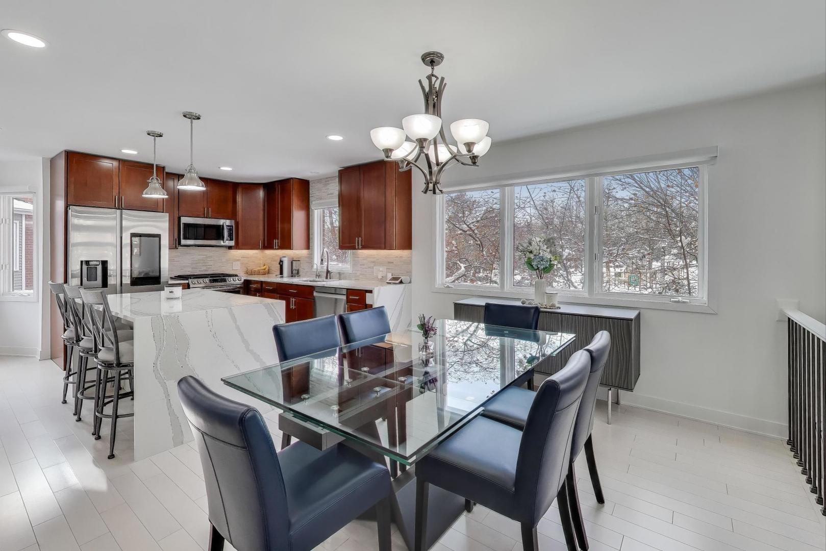 1459 West Wrightwood Avenue, Unit 1459 Chicago, IL 60614 - Photo 11 of 40 a dining room with furniture a chandelier and window
