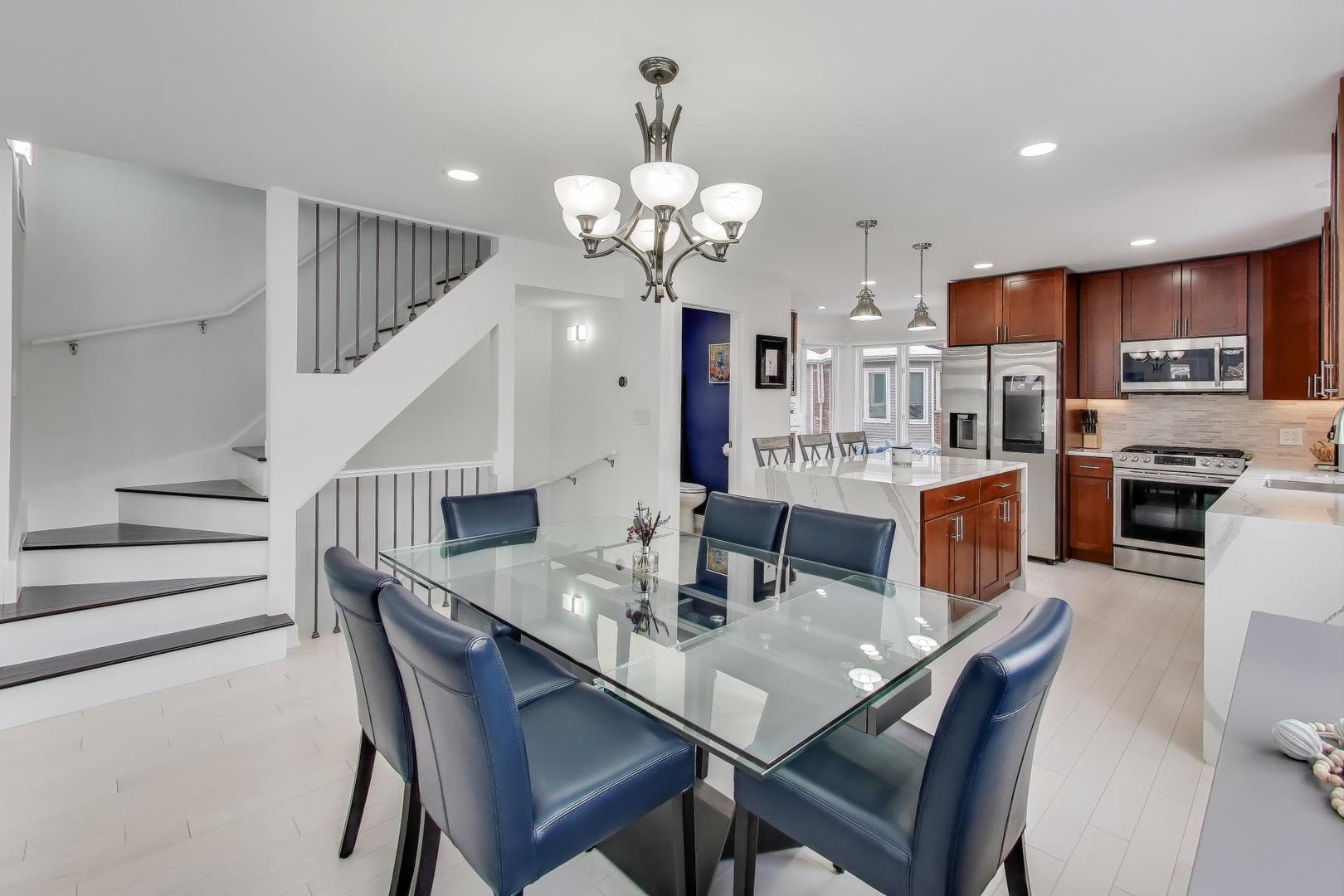1459 West Wrightwood Avenue, Unit 1459 Chicago, IL 60614 - Photo 13 of 40 a view of a dining room with furniture and wooden floor