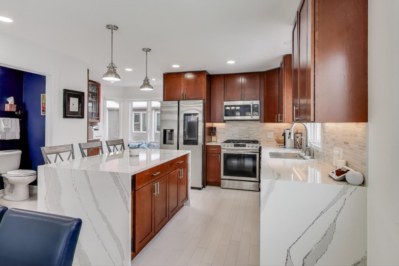 1459 West Wrightwood Avenue, Unit 1459 Chicago, IL 60614 - Photo 15 of 40 a large kitchen with stainless steel appliances a stove sink and cabinets