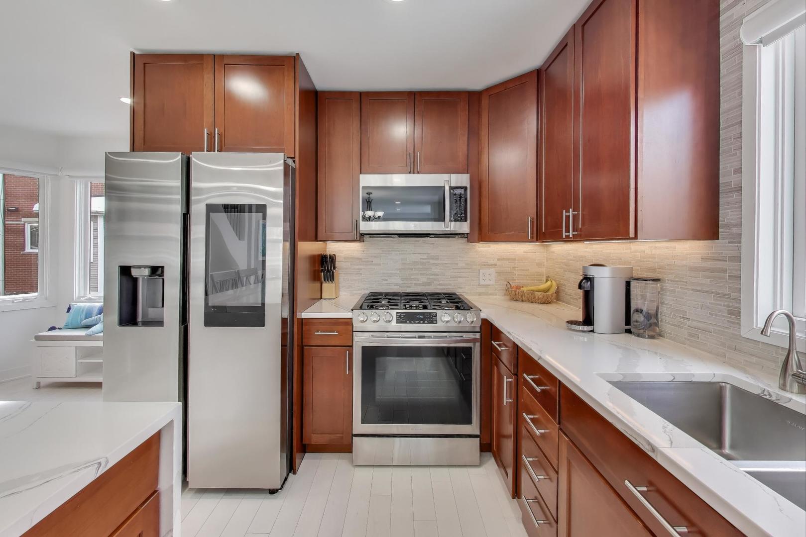 1459 West Wrightwood Avenue, Unit 1459 Chicago, IL 60614 - Photo 16 of 40 a kitchen with a sink stove and refrigerator