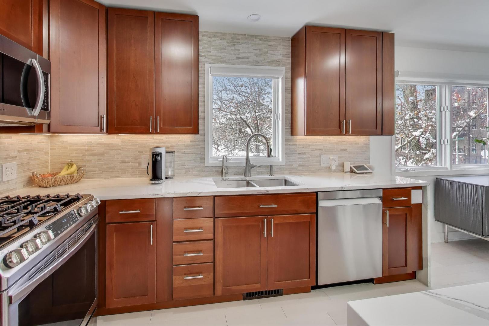 1459 West Wrightwood Avenue, Unit 1459 Chicago, IL 60614 - Photo 17 of 40 a kitchen with stainless steel appliances granite countertop a sink stove and cabinets
