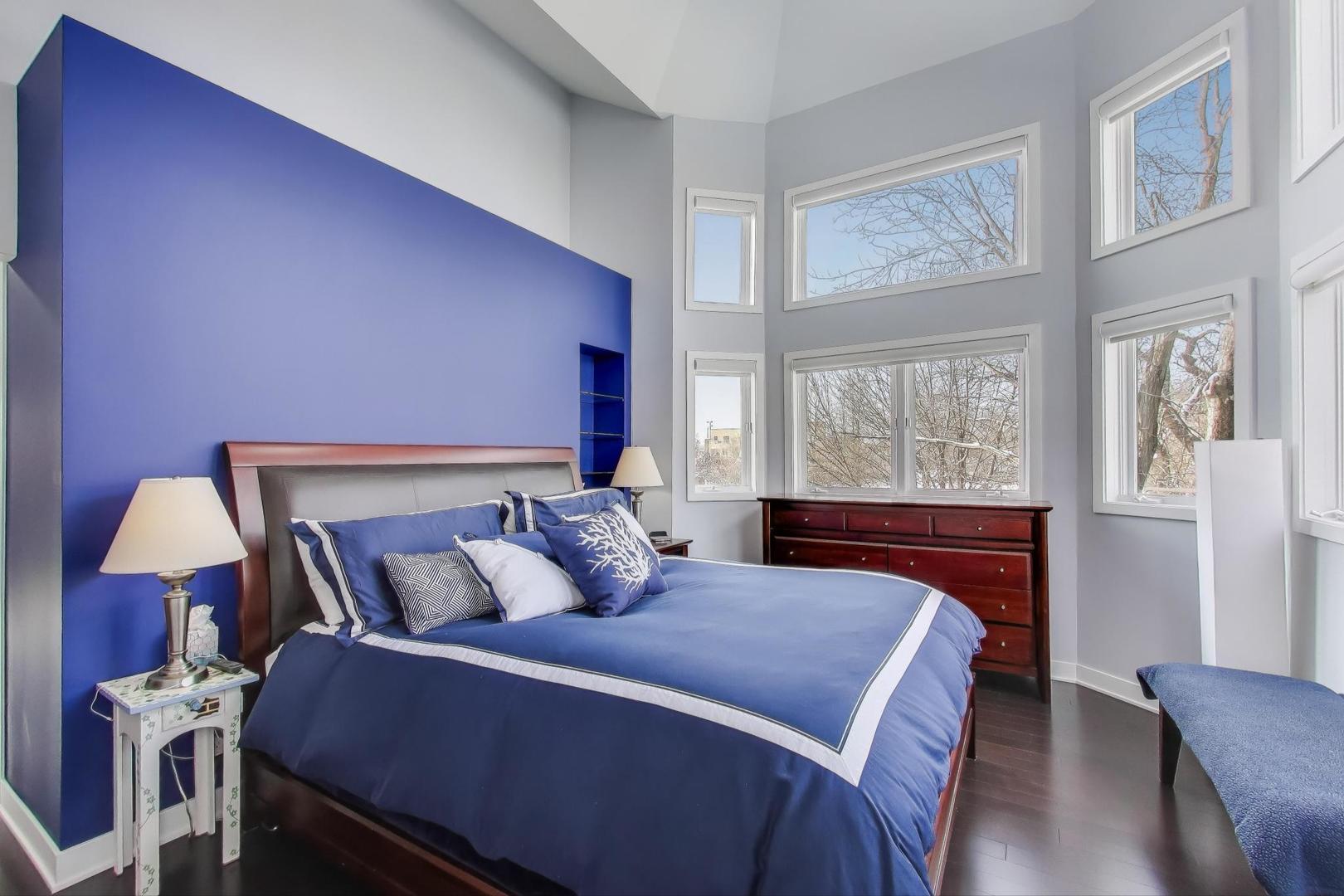 1459 West Wrightwood Avenue, Unit 1459 Chicago, IL 60614 - Photo 20 of 40 a bedroom with a bed and wooden floor