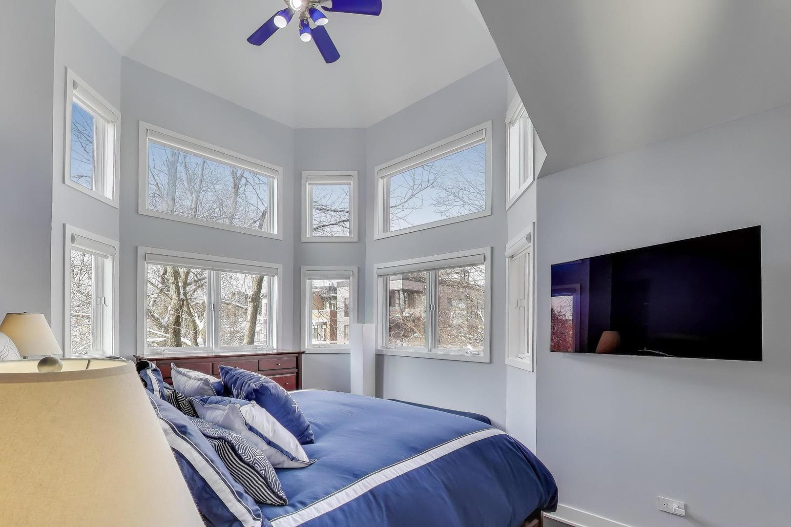 1459 West Wrightwood Avenue, Unit 1459 Chicago, IL 60614 - Photo 21 of 40 a living room with furniture and a flat screen tv