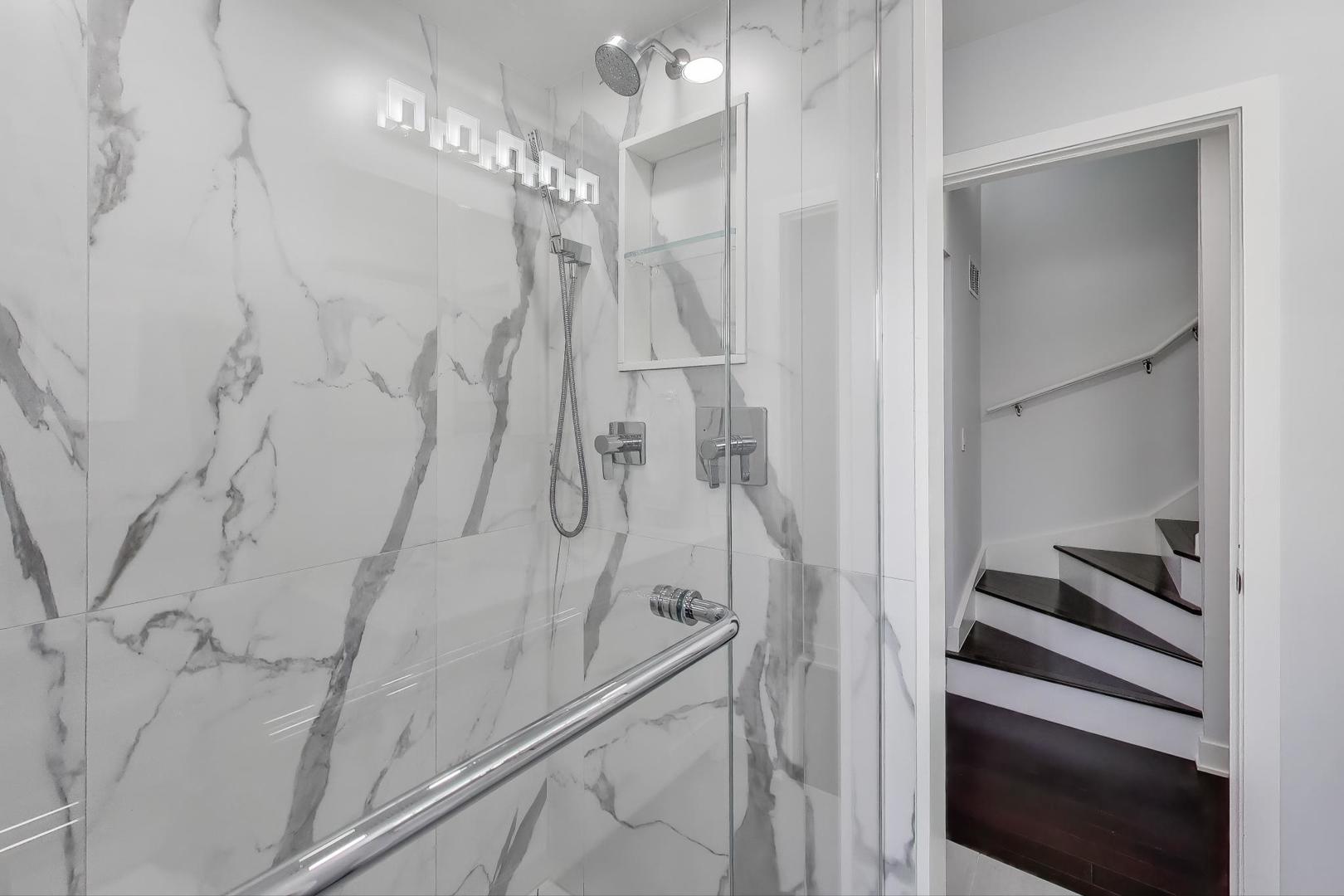 1459 West Wrightwood Avenue, Unit 1459 Chicago, IL 60614 - Photo 24 of 40 a bathroom with a shower and a mirror