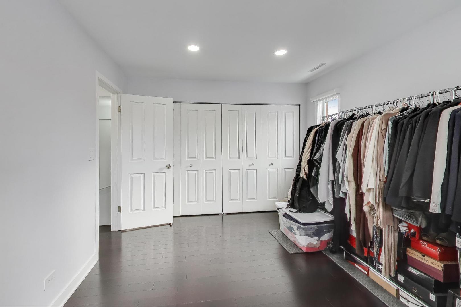 1459 West Wrightwood Avenue, Unit 1459 Chicago, IL 60614 - Photo 26 of 40 a view of walk in closet with clothes and shoes