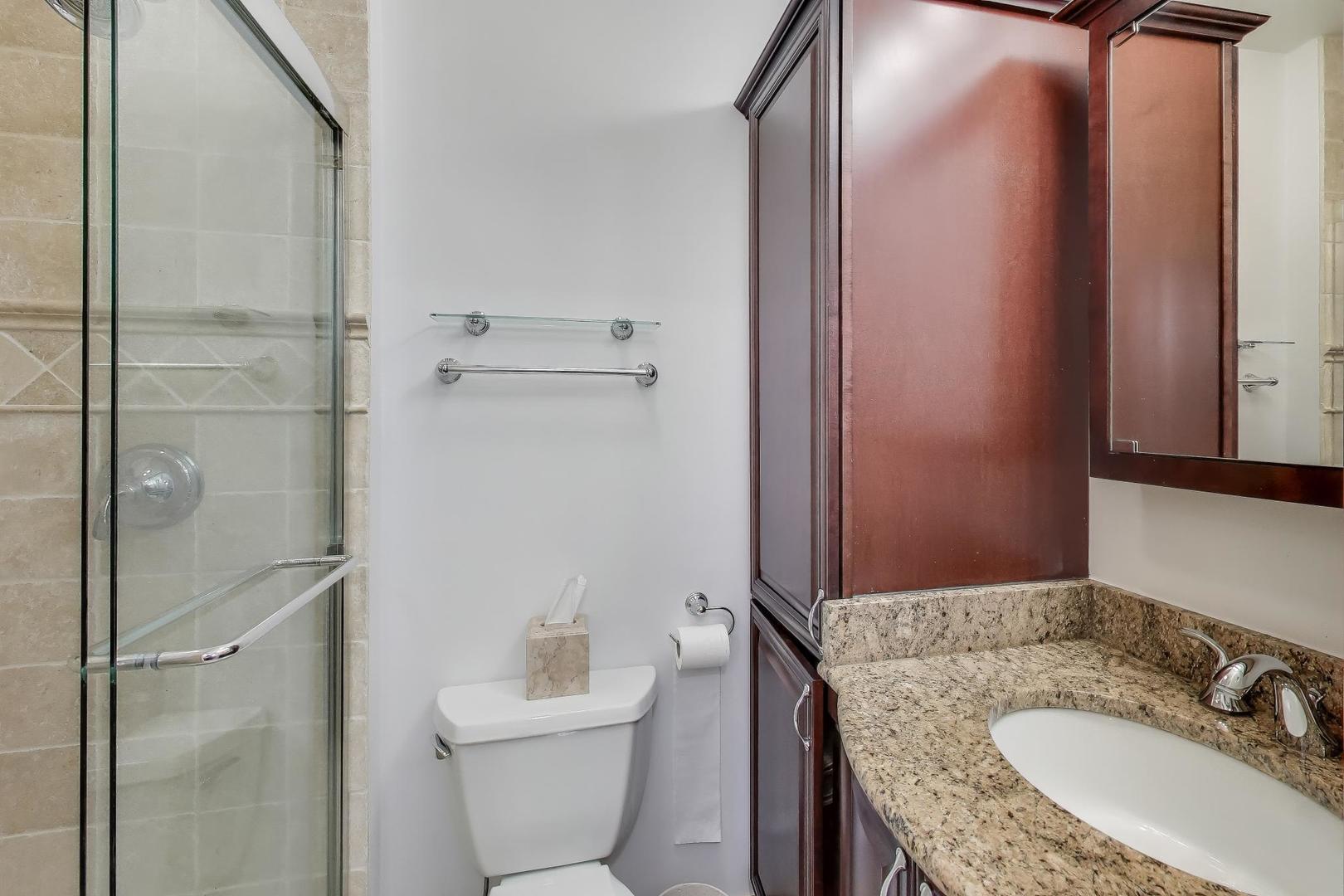 1459 West Wrightwood Avenue, Unit 1459 Chicago, IL 60614 - Photo 27 of 40 a bathroom with a granite countertop sink toilet and shower