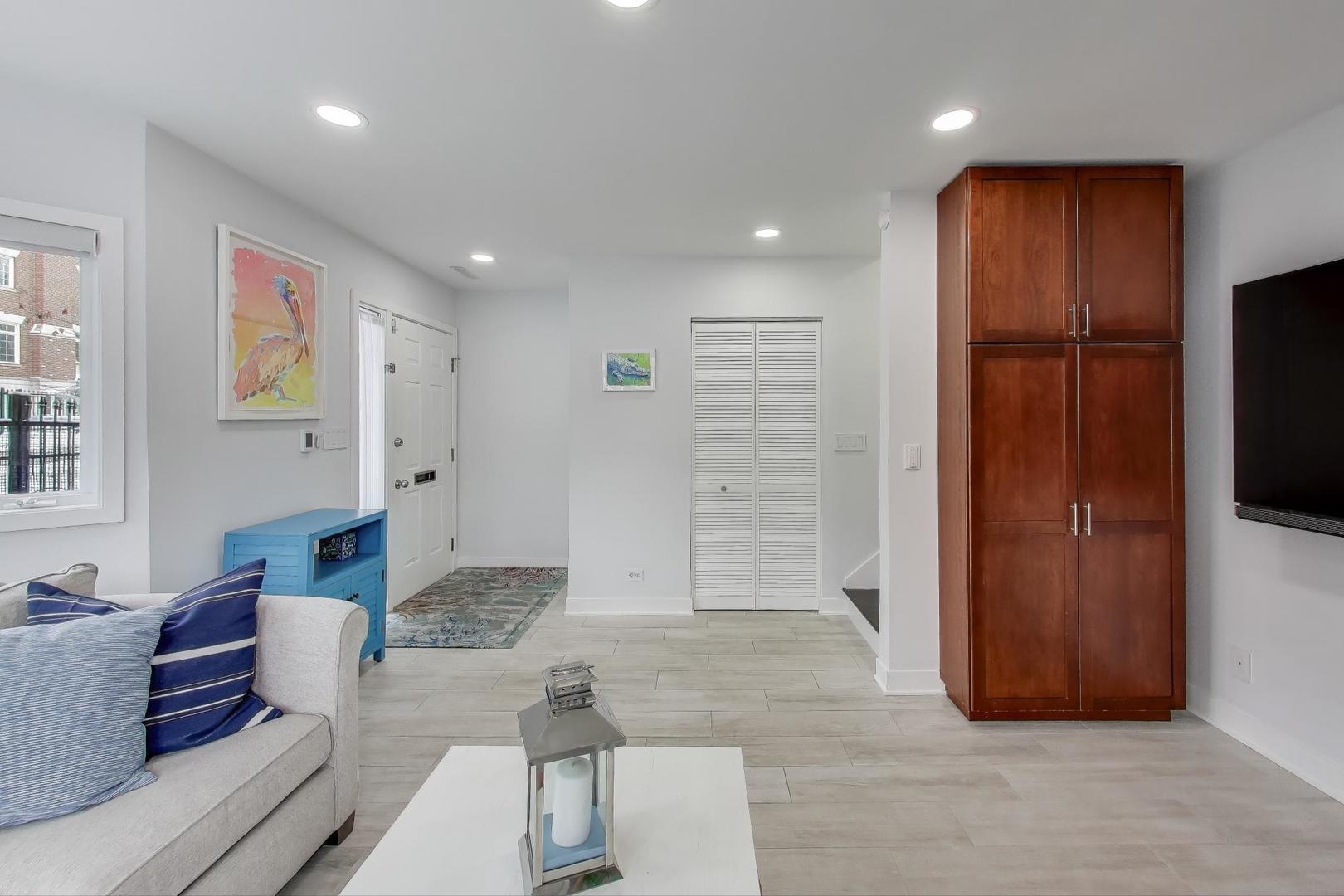 1459 West Wrightwood Avenue, Unit 1459 Chicago, IL 60614 - Photo 7 of 40 a living room with furniture and a flat screen tv