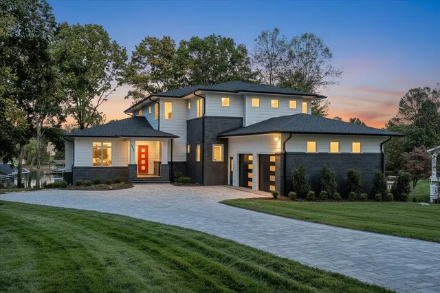 a front view of a house with a yard