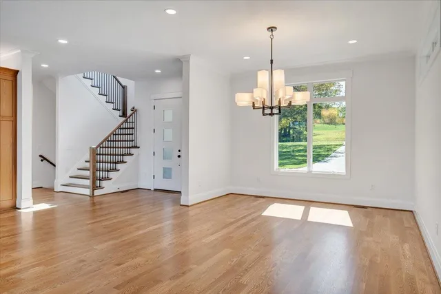 a spacious bathroom with a bathtub shower sink and mirror