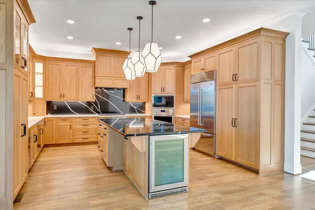 a front view of a building with a yard