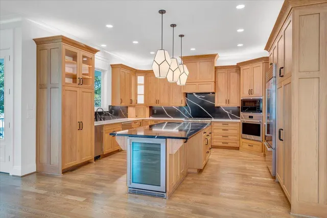 an aerial view of a houses with a lake view