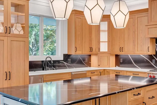 an aerial view of a house with a yard and garden