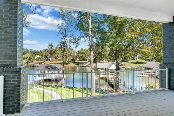 an aerial view of a houses with a lake view