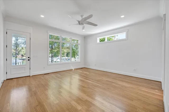 a aerial view of a house with swimming pool and outdoor seating