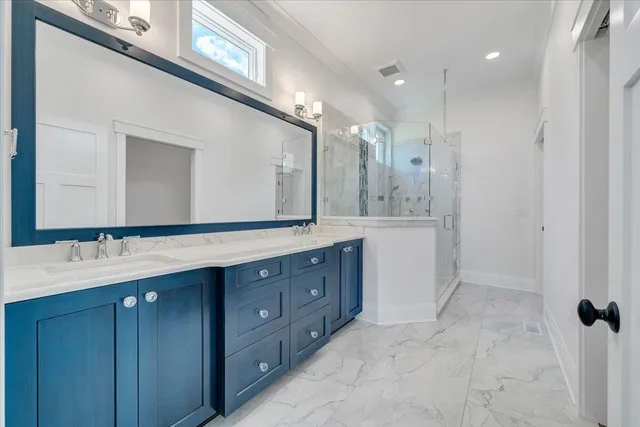 an aerial view of a house with swimming pool and a yard