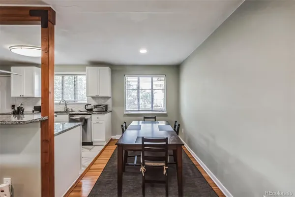 a kitchen with sink refrigerator and stove