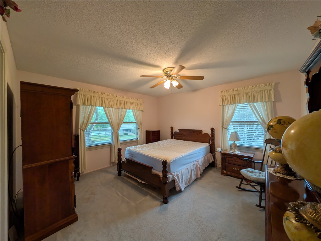1000 Hickory Lane Anderson, SC 29624 - Photo 12 of 37 This cozy bedroom features ample natural light and comfortable carpeted flooring, perfect for relaxation.